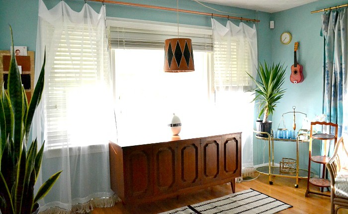 sheer-sequin-and-fringe-accented-curtains-flank-credenza (1)