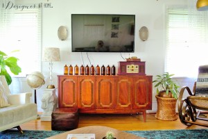 vintage credenza gone media console looks so good with all those rescued brown glass bottles!