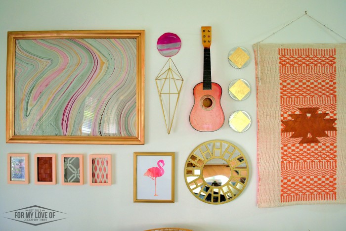 eclectic gallery wall with pops of peach, pink, magenta, gold and grey