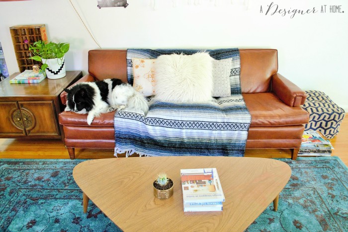 really cool vinyl sofa from the 50's a casually boho eclectic decorated space the living room of a 1950's brick ranch