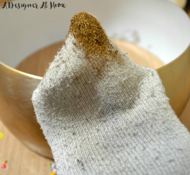 Use a small sock and the tip of a finger to spread the wax out lightly