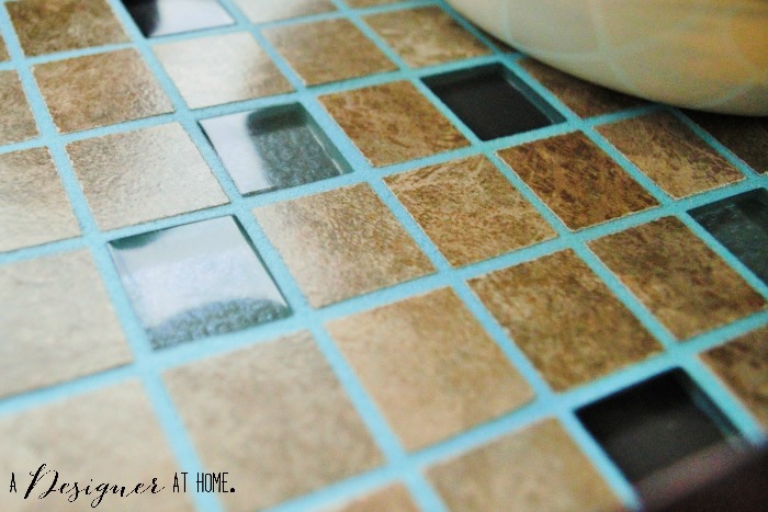 blue grout with natural stone mosaic tiles