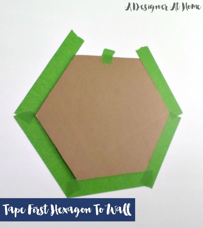 tape first hexagon onto wall, use a level to make sure it's straight