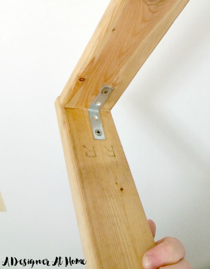 l-bracket-holds-two-salvaged-pieces-of-wood-together-wall-mounted-hanging-lamp-base