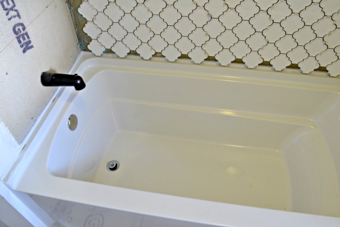 new-tub-vintage-bathroom-remodel-with-global-style-design