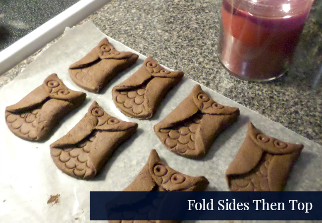 Folding cinnamon dough for owl ornaments