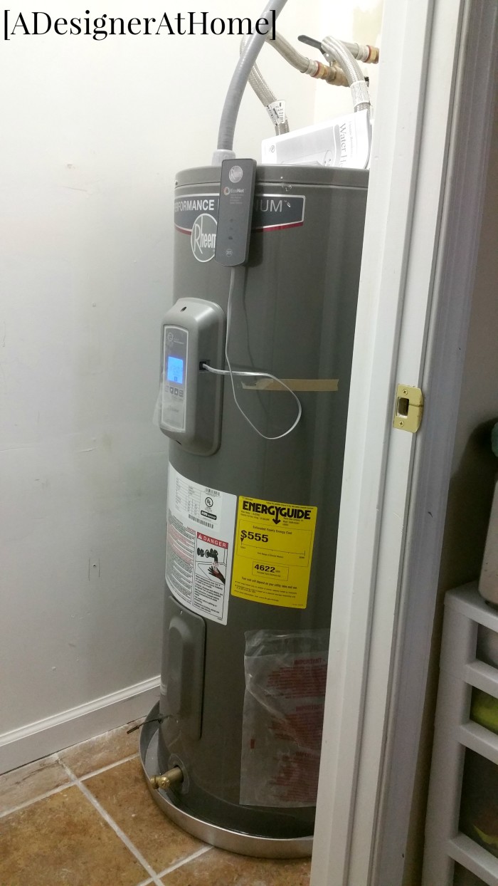 rheem hot water heater tucked into right side of underutilized pantry