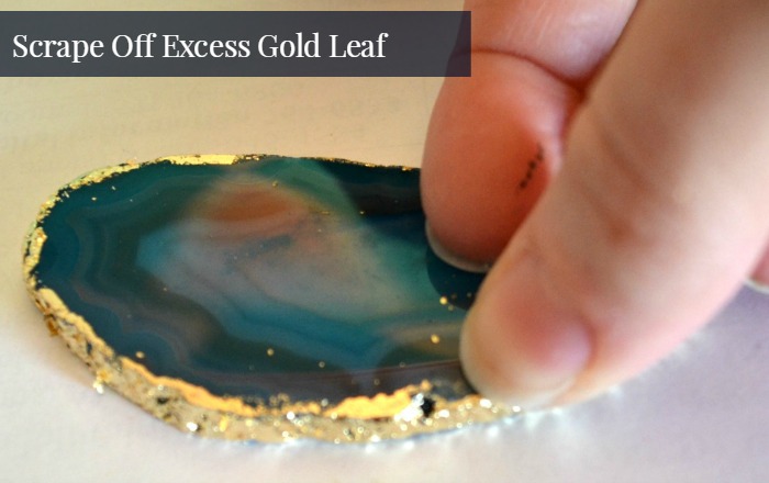scrape gold leaf from face of agate slice