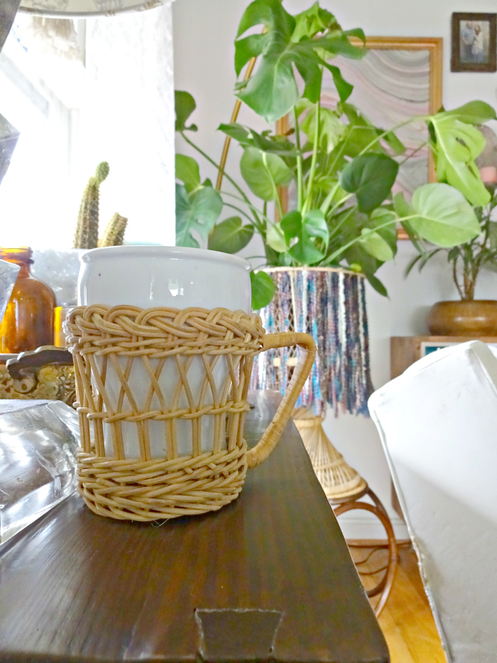 a cup of coffee and a split leaf philodendron, the perfect living room set up