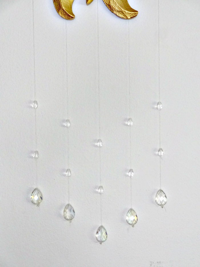 teardrop shaped faux crystals mimic the look of raindrops