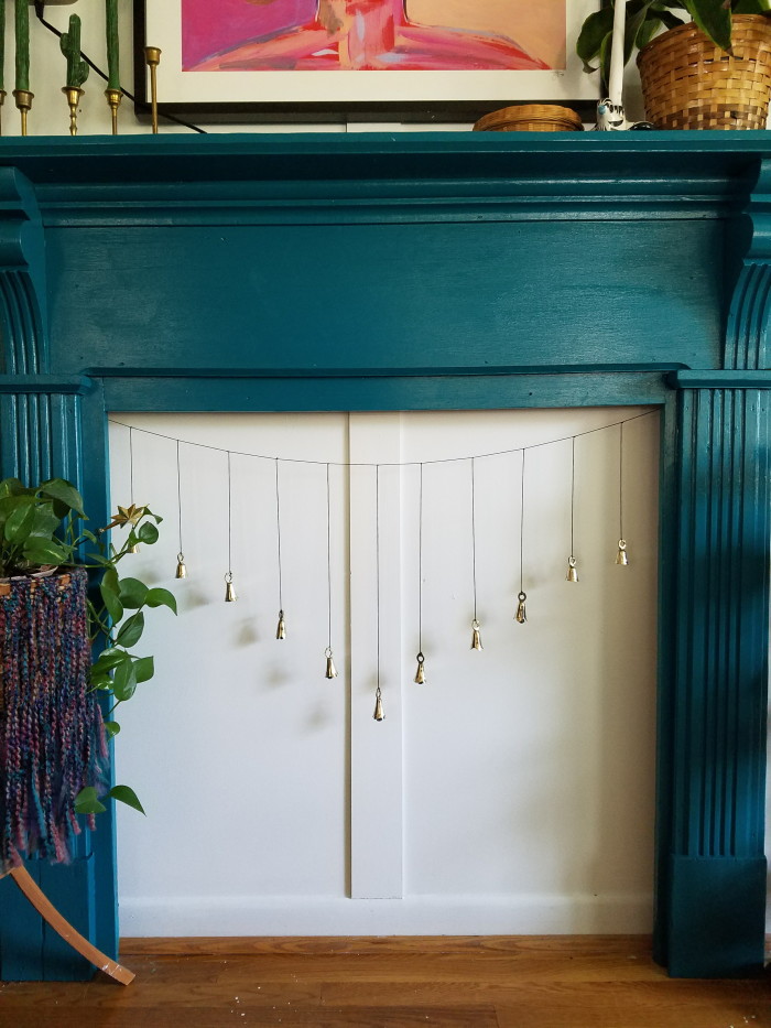 DIY home decorating adding missing character like teal fireplace, wainscoting and bell charm