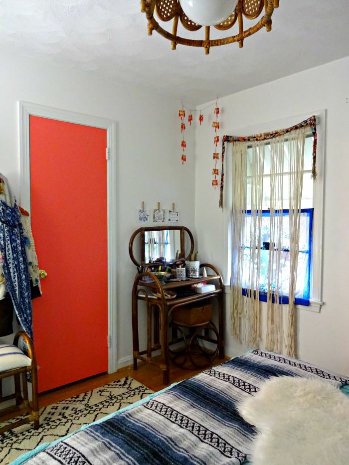 fitting a vanity into a small bedroom and using creativity as decor