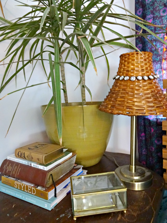 large nightstand for lots of books and a big plant