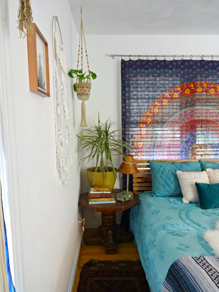 old vintage solid wood table serves as plant stand and nightstand