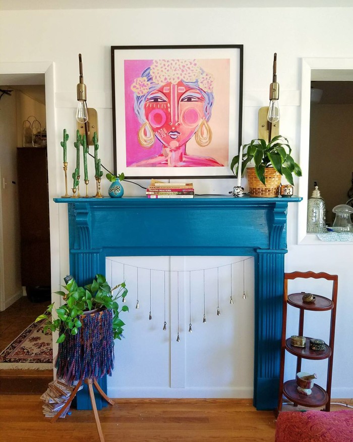 boho blue fireplace with pink and purple woman