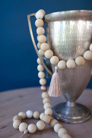 wood-bead-and-tassel-garland-DIY-via-cocokelley_5