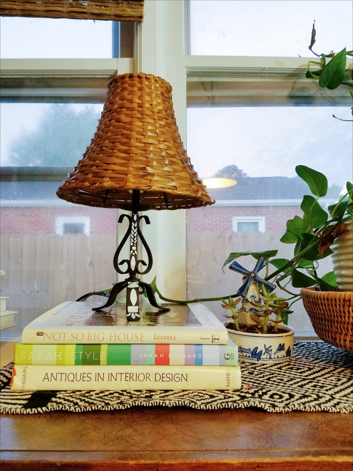 Faux bone inlay lamp atop new and old design books