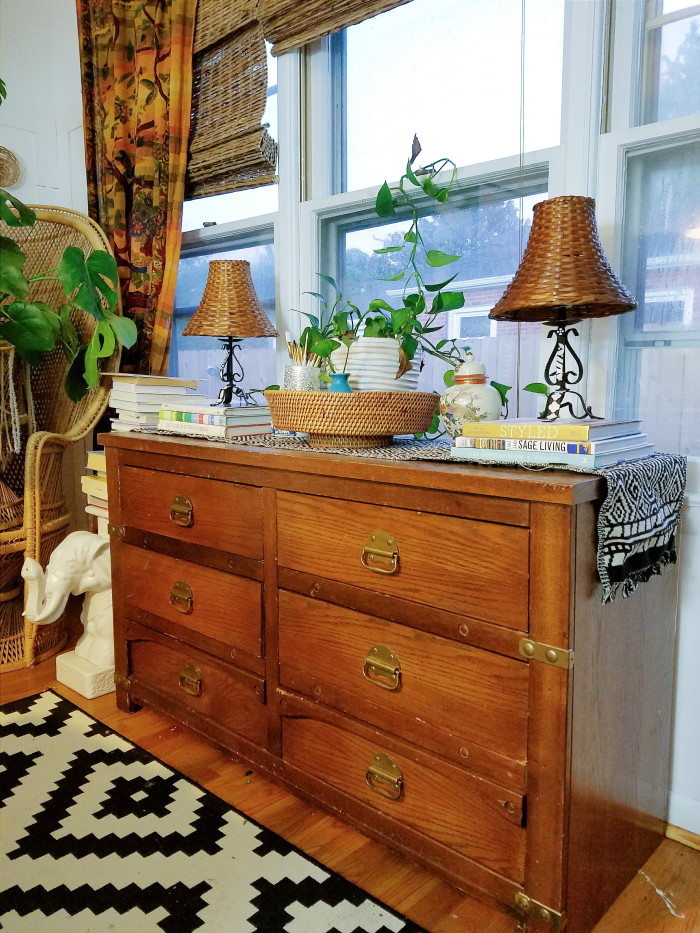 Thrifted dresser with interesting hardware styled as a dining room buffet credenza