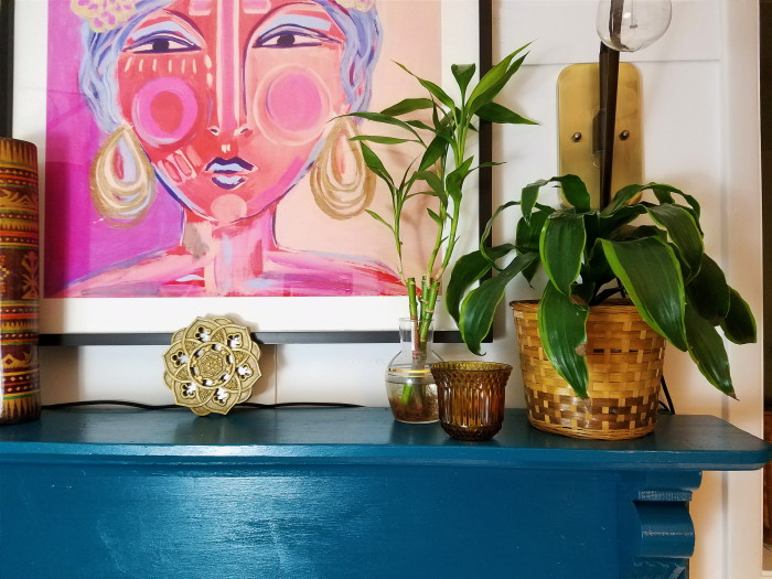 Blue Fireplace Mantle with plants and warm golden tones