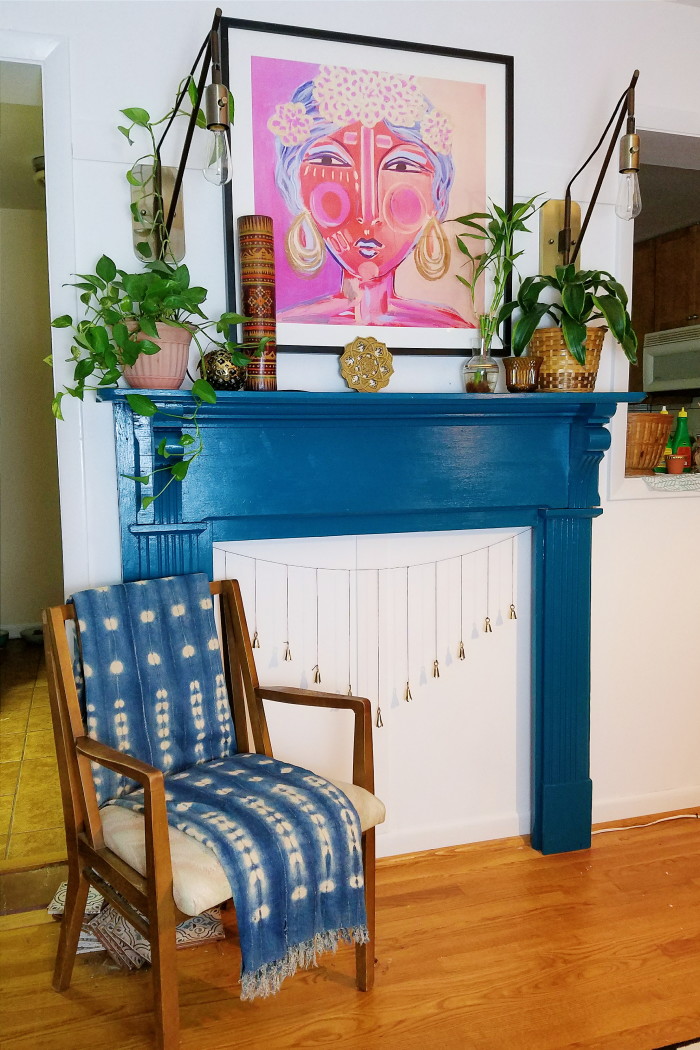 Bohemian fireplace mantle. Blue painted mantle. Plants, vintage finds and funky art.