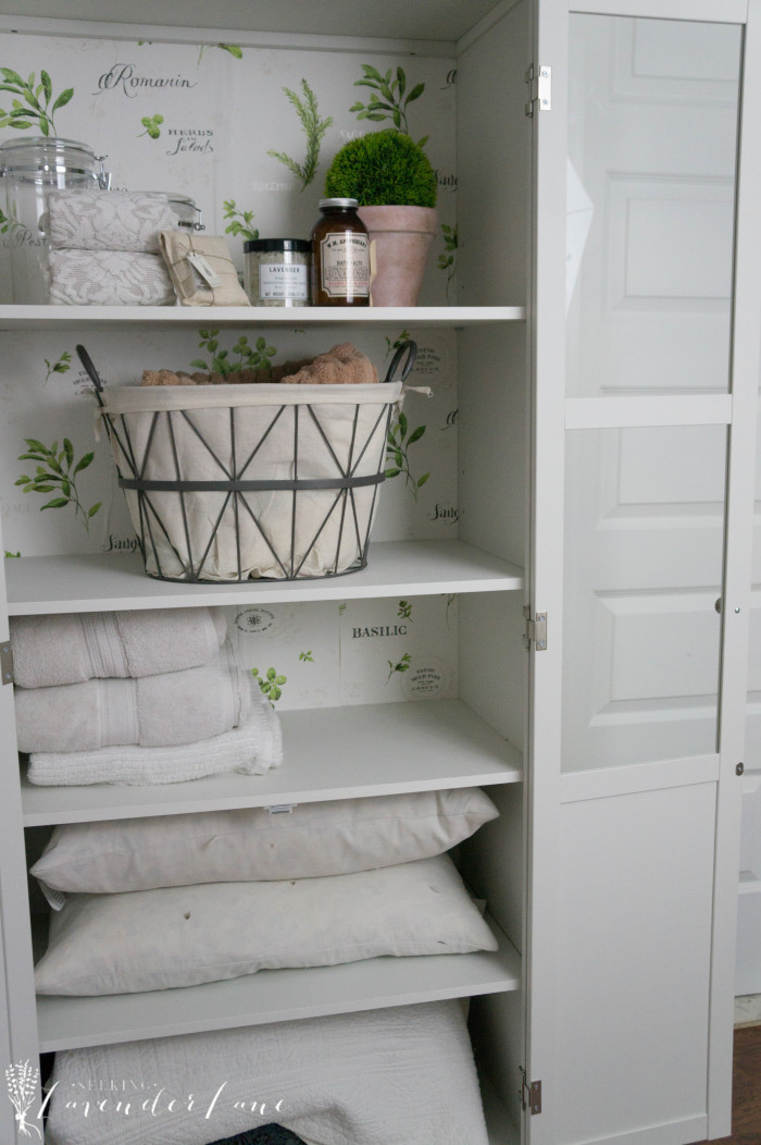 farmhouse-chic-herb-wallpaper-backed-linen-cabinet