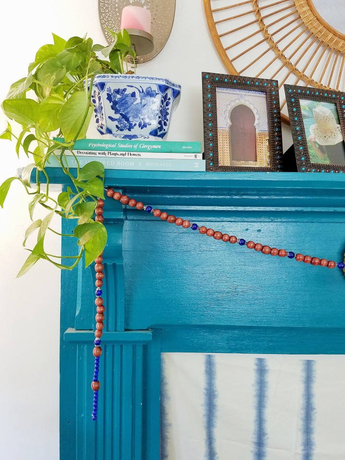 Blue fireplace mantle wood and blue bead bohemian garland mantle styling