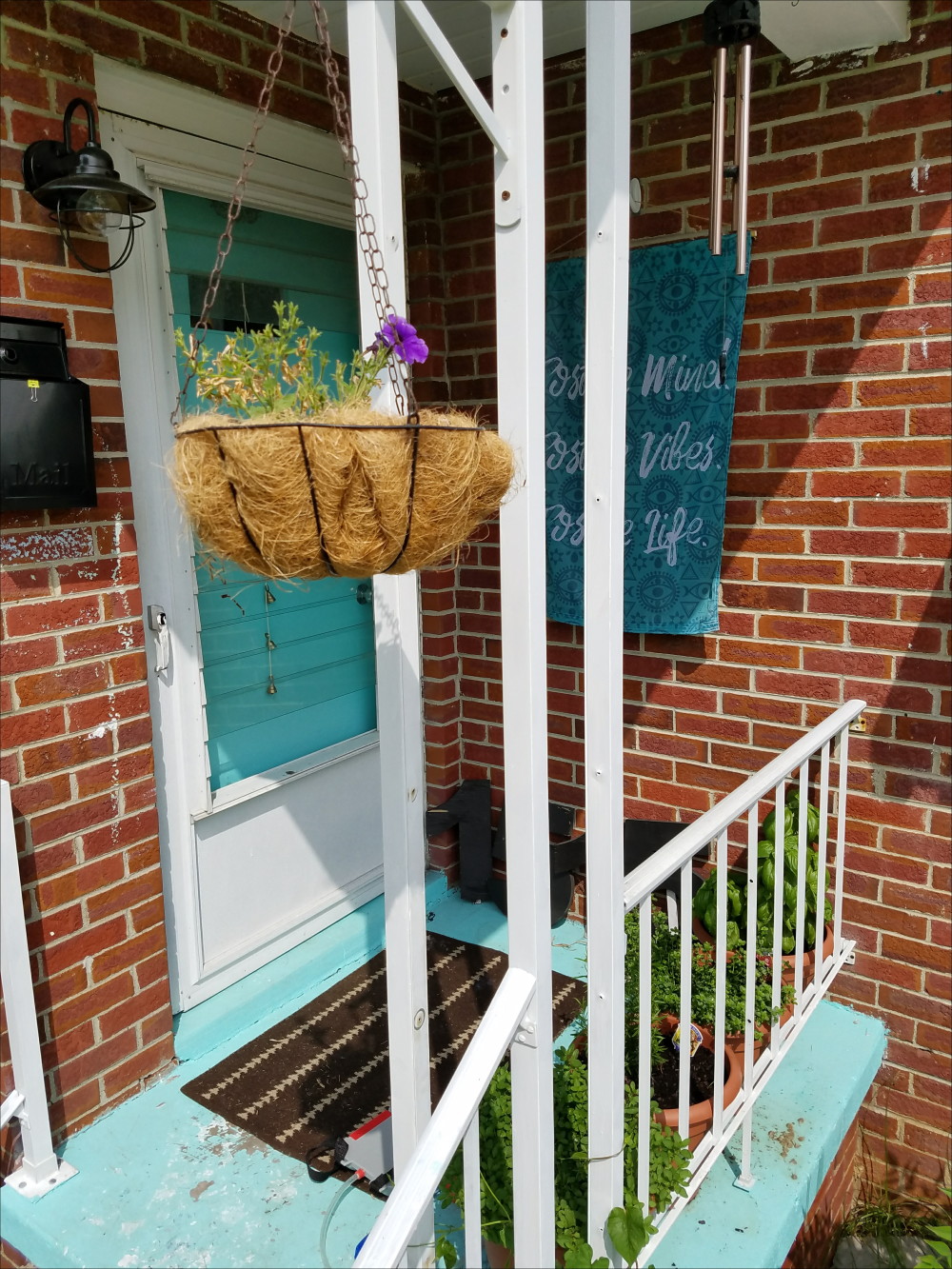 Brick home porch. Aqua front door - @adesignerathome