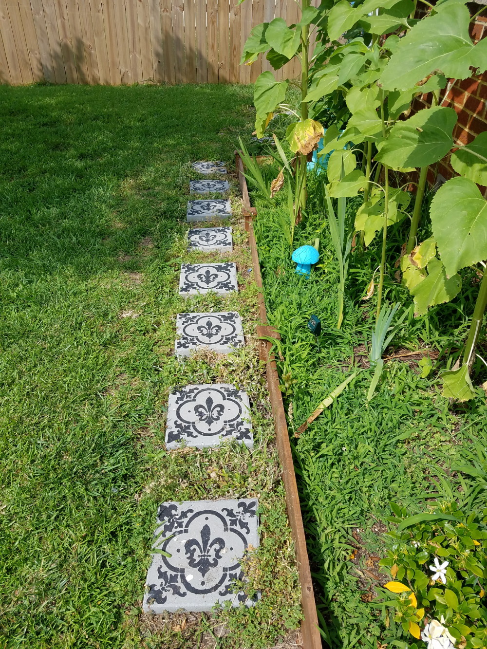 Yard stones painted to have a cement tile look. A boho garden in progress. @adesignerathome