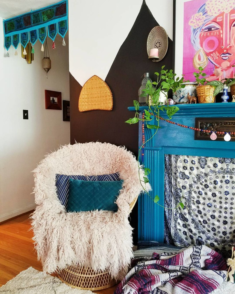 living room boho hallway fur covered chair and fireplace