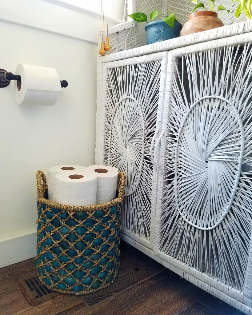 Basket full of toilet paper keeps guests at ease during the holidays since they won't have to worry about running out of toilet paper. 