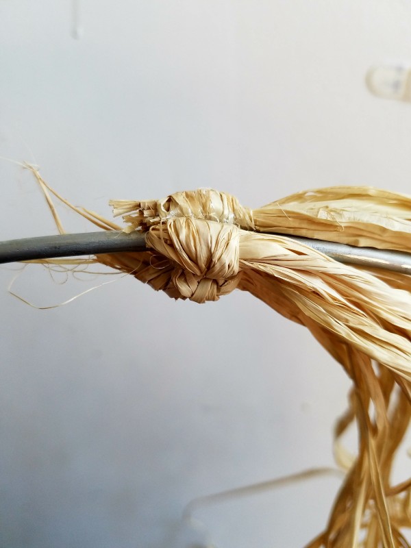 raffia bundles glued to hoop