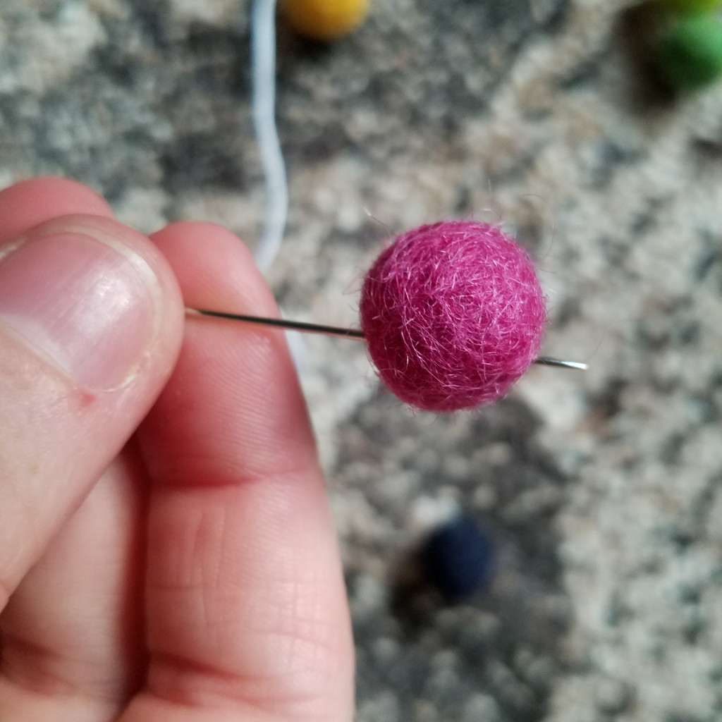 Threading with felt balls DIY