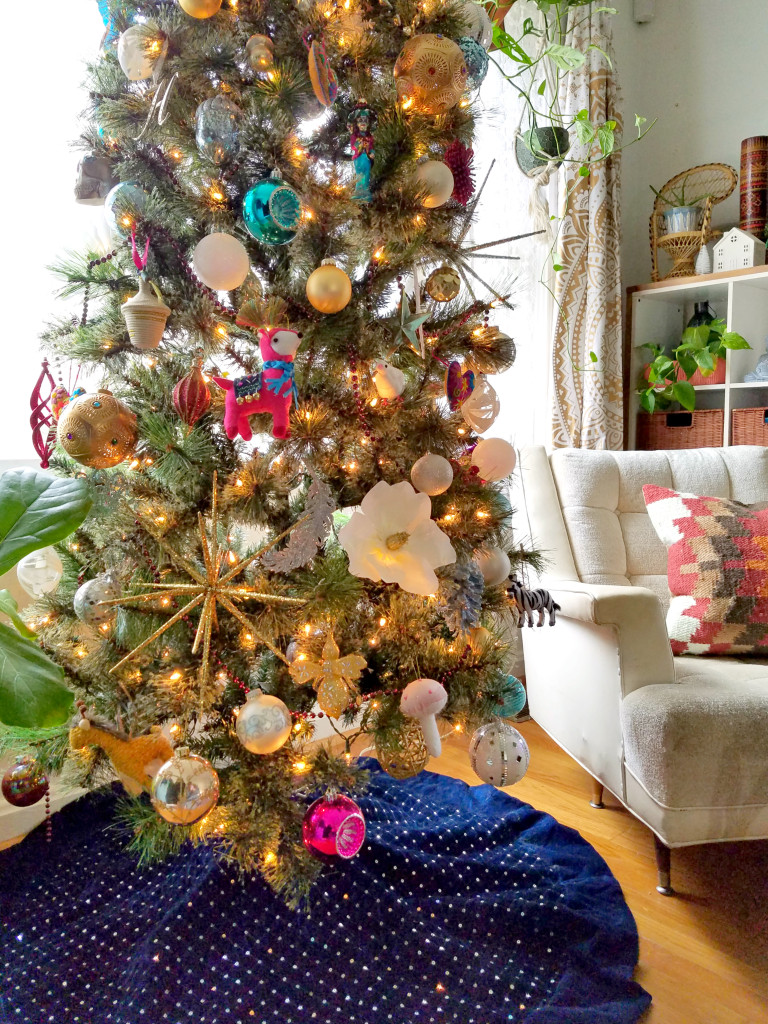 Global Boho Christmas Tree incorporates bright pops of color with whimsical mushroom, bird and flower ornaments