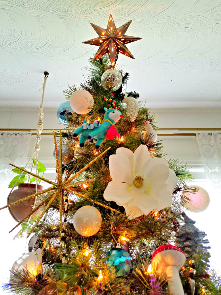 Global Boho Christmas Tree incorporates bright pops of color with whimsical mushroom, bird and flower ornaments