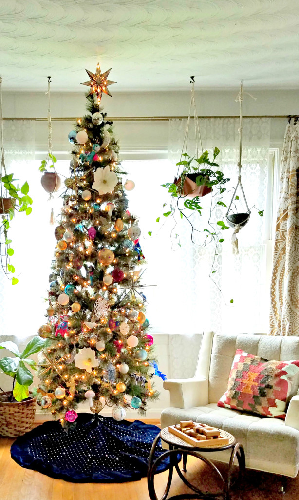 Global Boho Christmas Tree incorporates bright pops of color with whimsical mushroom, bird and flower ornaments