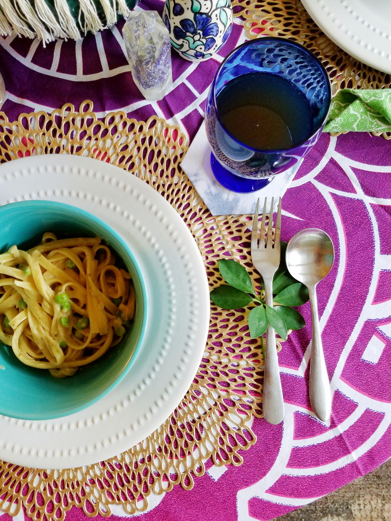 Vegan friendly fettuccine Alfredo spring table setting