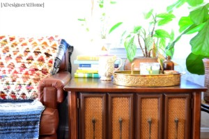 Vintage thrifted end table cabinet styled with bohemian decor