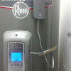 rheem hot water heater tucked into right side of underutilized pantry