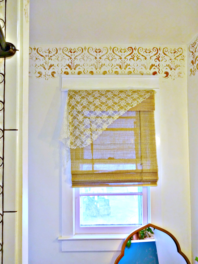 layered window treatments with a copper indian stencil border