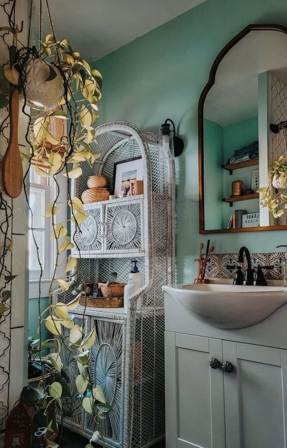 Sustainably Furnish A Home - A Vintage wicker cabinet adds chic storage to a bathroom